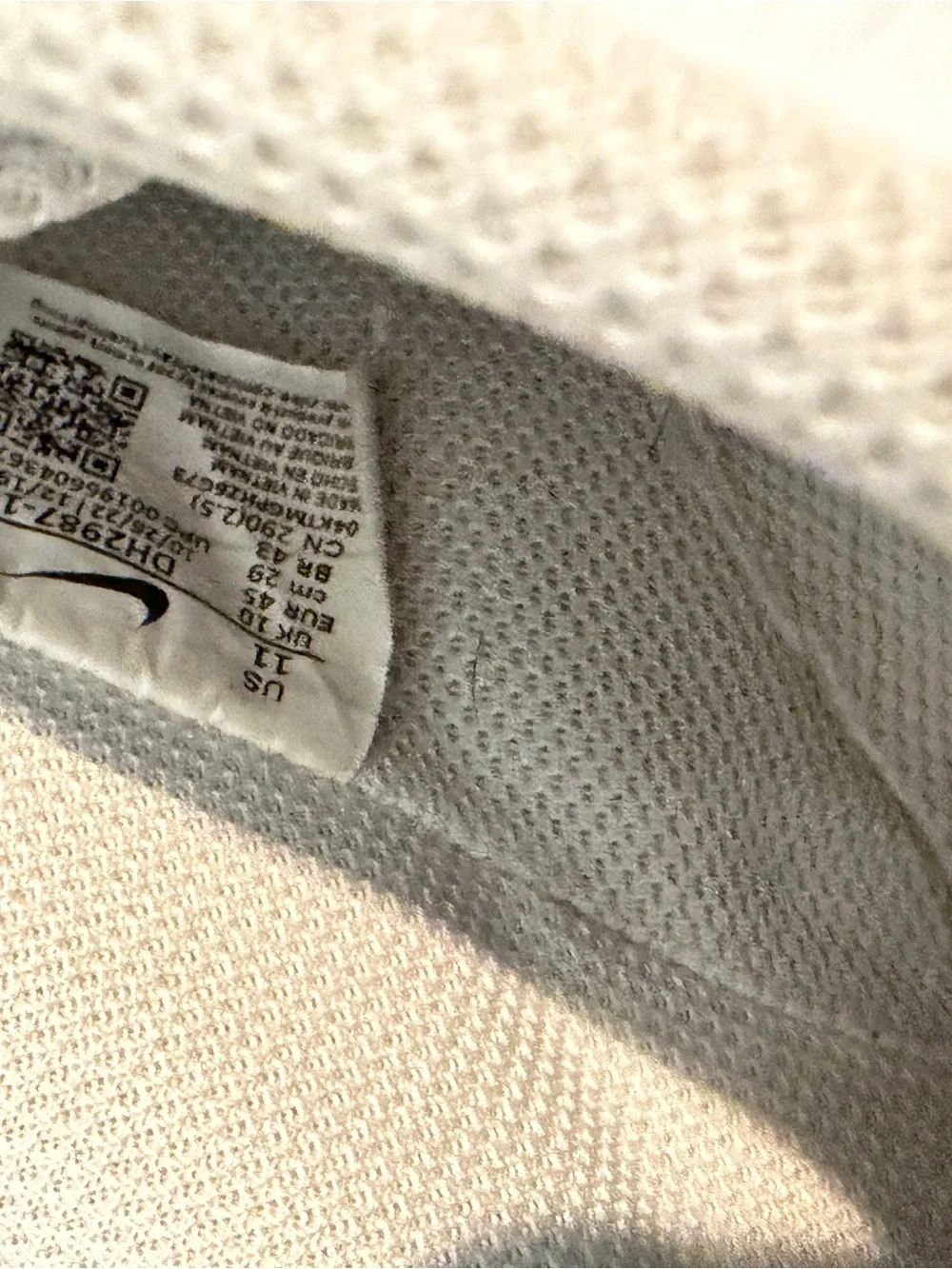 Nike White Low-Top Sneakers with Black Swoosh